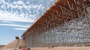 Timber scaffolding supporting a bridge span