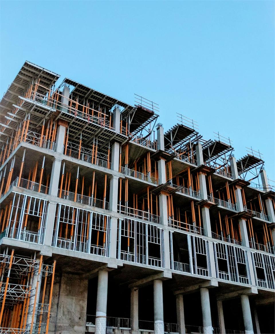 High-rise building under construction with scaffolding