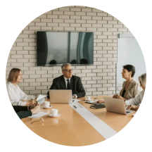 Leadership team meeting around a boardroom table