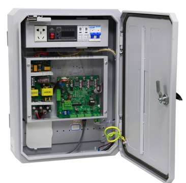 Integrated communication node enclosure with its door open, showing the controller and wiring inside