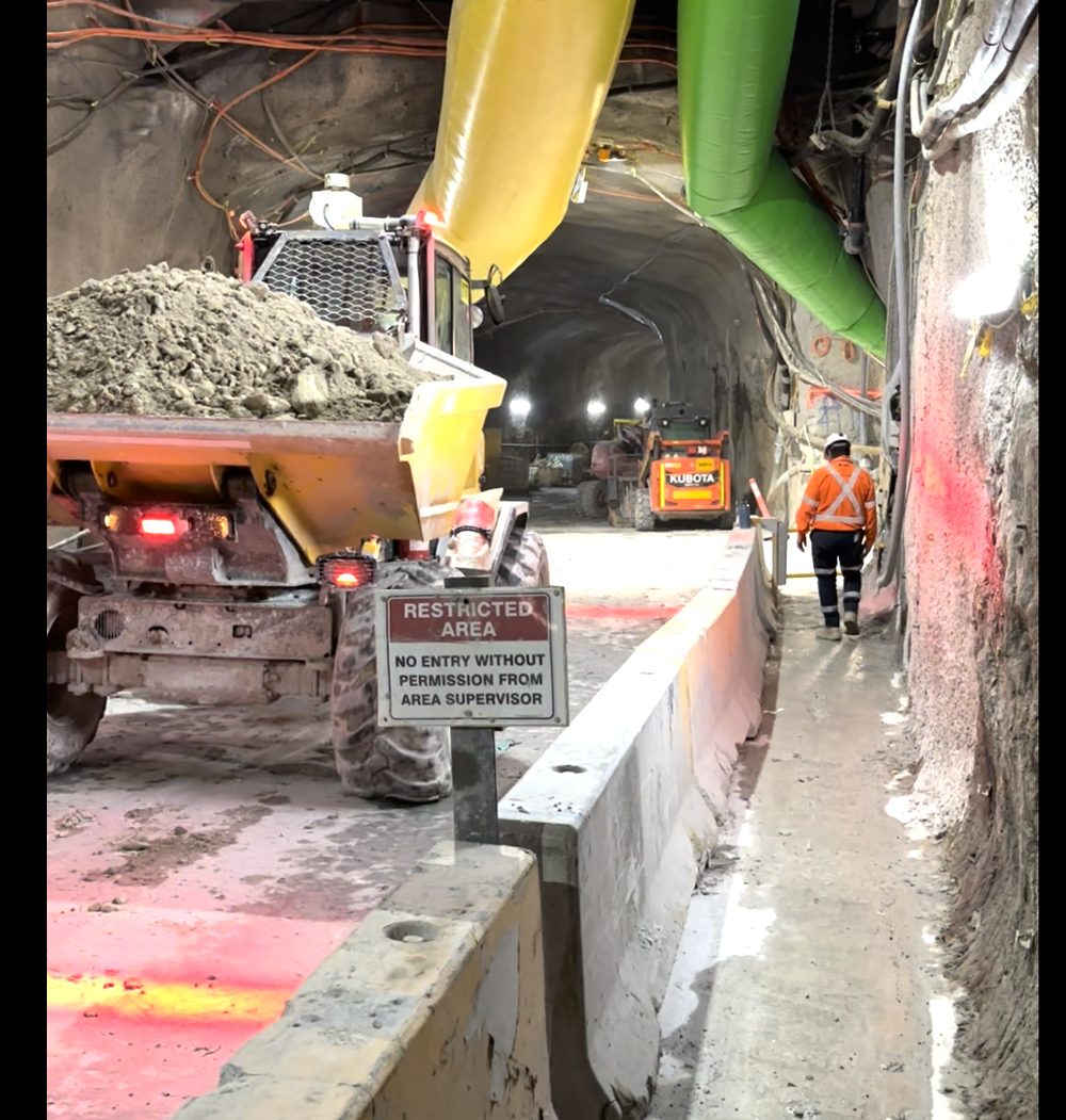 Dump truck passing an automated traffic control point in a tunnel