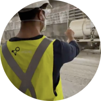 Worker in a high-visibility harness at a tunnel face