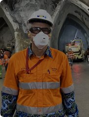Worker wearing a respirator mask underground