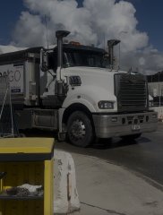 Haul truck moving through a surface work area
