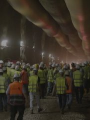 Workforce gathered inside an underground excavation