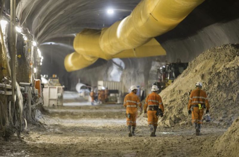 Crew walking through a tunnel during works