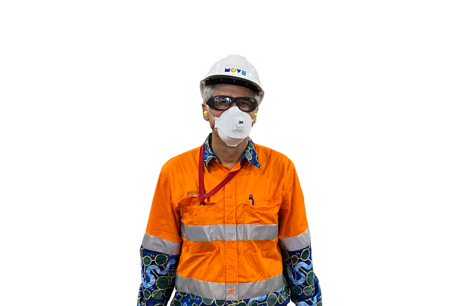 Safety manager wearing a respirator and hard hat on a dusty tunnel site
