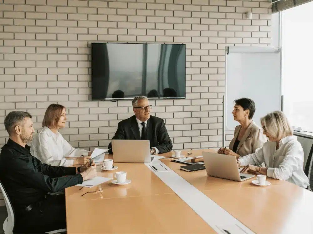 Asset owners meeting around a boardroom table